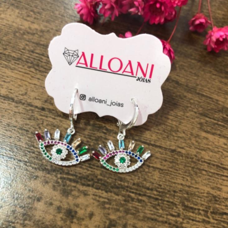 Brinco argolinha de click olho Grego cravejado